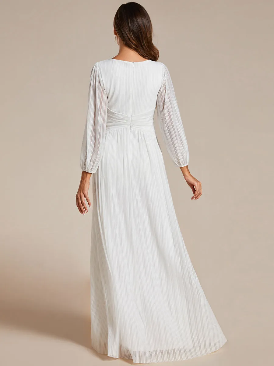 Robe de soirée trapèze à manches longues et taille empire scintillante